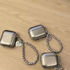 AirPods gegalvaniseerd zilveren beschermhoes Glanzende duurzame TPU-cover met sleutelhangerbedel Stijlvolle metalen afwerking Schokbestendig accessoire Cadeau