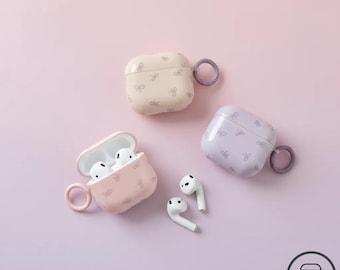 Nueva funda para AirPods con lazo, rosa, lavanda y beige. Funda suave para auriculares inalámbricos IMD con anillo. Lindo regalo tecnológico en tonos pastel para chicas y adolescentes.