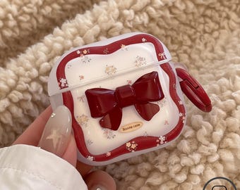 Funda roja con lazo floral para AirPods 4, Pro 2 y 3.ª generación: funda protectora retro con colgante, bonito accesorio anticaída para auriculares Bluetooth.
