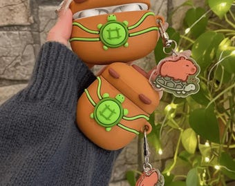 Funda de silicona con diseño de capibara para AirPods: funda protectora con diseño de animales Kawaii y clip. Accesorio tecnológico portátil para uso diario. Regalo ideal para auriculares.