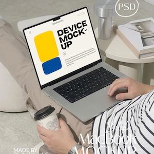 May include: A silver laptop displaying a website with the text DEVICE MOCK-UP, a yellow rectangle, and a blue rectangle. The screen also features the text DigitalHearthCo and smaller descriptive text. The laptop has a black keyboard and trackpad.