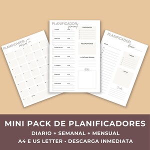 May include: A set of three white paper planners with the text "PLANIFICADOR" in a handwritten font. The planners include a monthly calendar, a weekly schedule, and a daily planner. The bottom of the image reads "MINI PACK DE PLANIFICADORES".