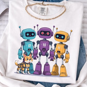 May include: White sweatshirt featuring a colorful graphic of three robots and a robot dog. The robots are blue, purple, and yellow, each with a unique number. The dog is tan and orange. The sweatshirt has a gold chain necklace.
