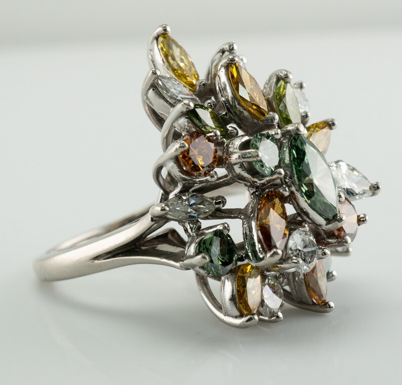 Multicolor Fancy Diamond Cluster Ring, Platinum Cocktail Statement Ring. This gorgeous ring is crafted in Platinum, set with  diamonds of various colors, Green, Orange, Olive & White diamonds.