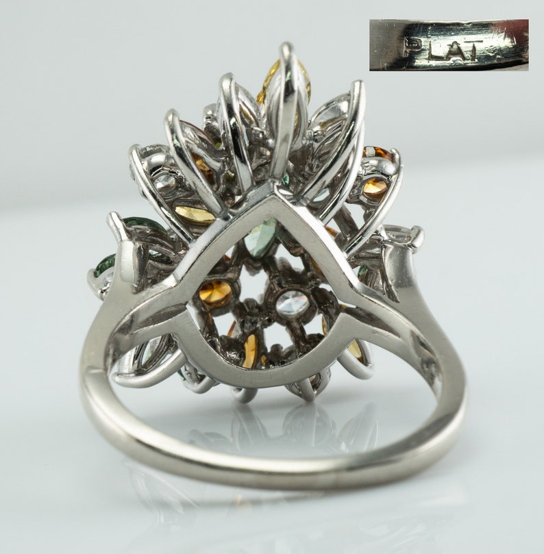 Multicolor Fancy Diamond Cluster Ring, Platinum Cocktail Statement Ring. This gorgeous ring is crafted in Platinum, set with  diamonds of various colors, Green, Orange, Olive & White diamonds.