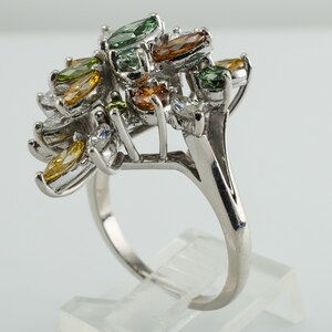 Multicolor Fancy Diamond Cluster Ring, Platinum Cocktail Statement Ring. This gorgeous ring is crafted in Platinum, set with  diamonds of various colors, Green, Orange, Olive & White diamonds.