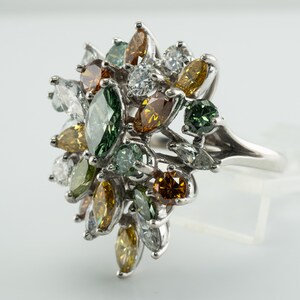 Multicolor Fancy Diamond Cluster Ring, Platinum Cocktail Statement Ring. This gorgeous ring is crafted in Platinum, set with  diamonds of various colors, Green, Orange, Olive & White diamonds.