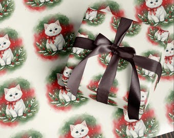 May include: White wrapping paper with a repeating pattern of watercolor kittens wearing red bows, surrounded by a Christmas wreath design. A wrapped gift with a dark brown satin bow is in the foreground.