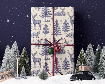 May include: A wrapped gift with a cream-colored paper featuring a blue deer, fox, and tree pattern. The gift is tied with a burgundy ribbon and adorned with green and red ornaments. Miniature Christmas trees and a toy car with a gift on top are in the foreground.