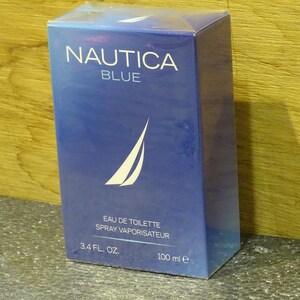 May include: A blue rectangular box of Nautica Blue eau de toilette. The box features the brand name in white, a white sailboat logo, and the text "EAU DE TOILETTE SPRAY VAPORISATEUR". It contains 3.4 fl. oz. / 100 ml.