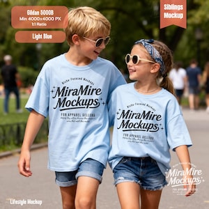 May include: Two children wearing light blue t-shirts with the text "MiraMire Mockups" in black. The shirts are paired with denim shorts. The image is a lifestyle mockup, showcasing apparel for sellers.