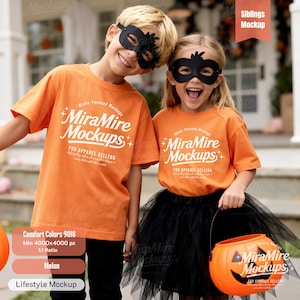 May include: Two children wearing black masks and orange t-shirts with the text "MiraMire Mockups". The girl wears a black tutu and holds an orange pumpkin-shaped candy bucket. The boy and girl are smiling.