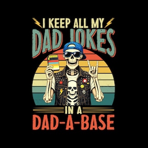 May include: A graphic tee featuring a skeleton wearing sunglasses and a blue cap, holding a data card. The text reads "I KEEP ALL MY DAD JOKES IN A DAD-A-BASE" in a retro font, set against a sunset background.