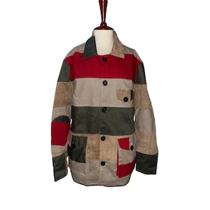 May include: A patchwork jacket with a collared neckline and button-up front. The jacket features a color block design with red, green, tan, and beige panels. It has two front pockets and is displayed on a mannequin.