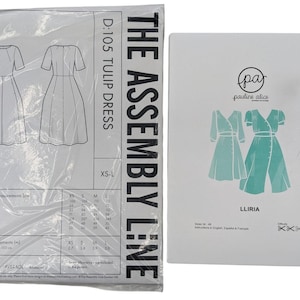 May include: Two sewing pattern envelopes. The left envelope is labeled The Assembly Line D:105 Tulip Dress with size range XS-L and a garment measurement chart. The right envelope is labeled Pauline Alice Liria with a teal dress illustration.