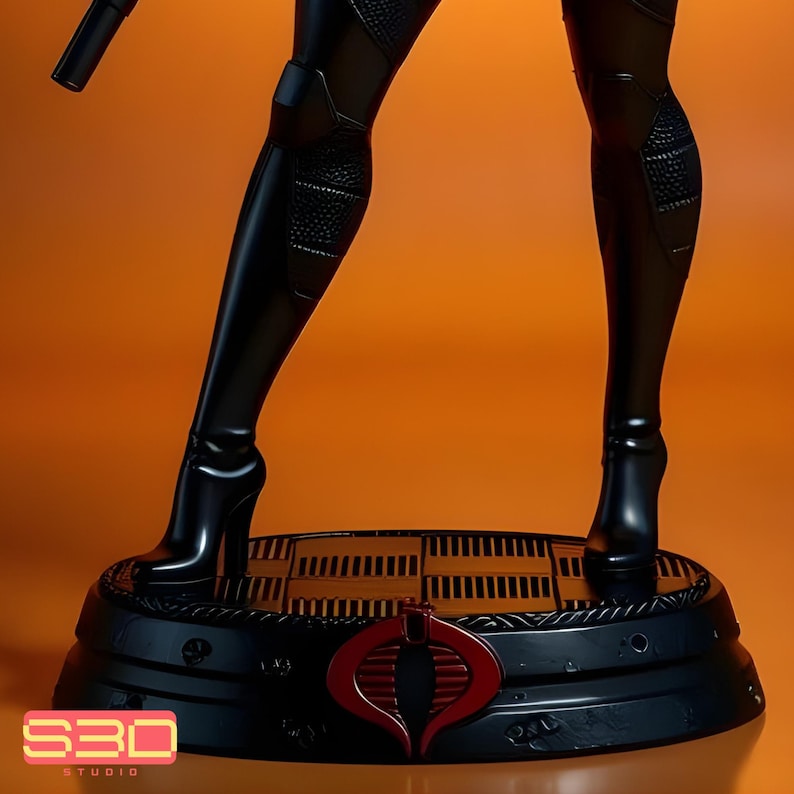 May include: A black figurine of a character in a sleek, form-fitting outfit, standing on a detailed base. The base features a red emblem and the text "S3D STUDIO". The figure's high-heeled boots and overall design suggest a futuristic or action-oriented theme.
