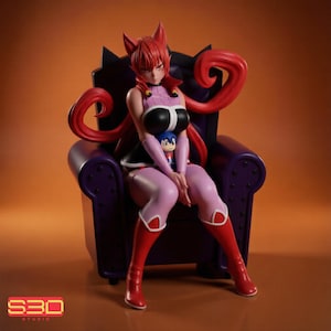May include: A collectible anime-style figurine of a red-haired character with fox-like ears sitting on a dark purple armchair. The character wears a black and pink outfit with red boots and holds a small blue-haired doll figure in their lap.