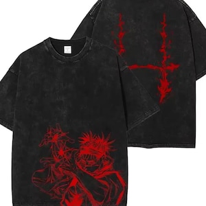 May include: Black t-shirt featuring a red anime character graphic on the front and a red design on the back. The shirt has a washed-out, vintage look.
