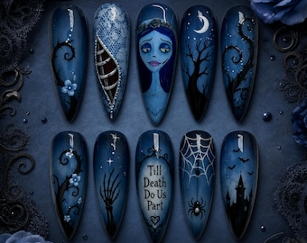 May include: A set of ten stiletto-shaped press-on nails featuring a dark blue theme with hand-painted designs including a blue-skinned character, a ribcage, a skeleton hand, a spider web with a spider, a castle, and the text Till Death Do Us Part.