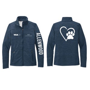 May include: A navy blue fleece jacket with a white paw print heart on the back. The left sleeve has the text "ALLENWOOD" in white. The front of the jacket has a white VCA logo and the text "Katy Vet Tech Assistant".