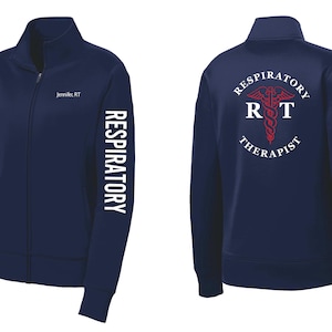 May include: A navy blue zippered jacket with the words "RESPIRATORY THERAPIST" and a red medical symbol on the back. The left sleeve has the word "RESPIRATORY" printed vertically.