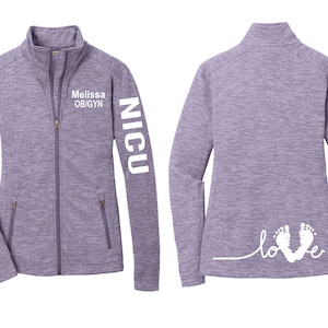 May include: Purple fleece jacket with a zipper closure and two pockets. The left sleeve has the text "NICU" printed on it. The right side of the jacket has the text "Melissa OB/GYN" printed on it. The back of the jacket has the text "love" with two footprints.