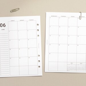 May include: Two white paper calendar inserts with black text and grid lines. The left page shows June with a task list, while the right page shows the remainder of the month with Wednesday through Saturday headers and small May and July calendars.