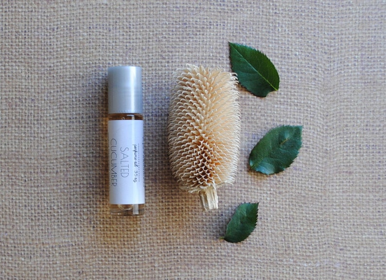 salted cucumber perfume oil in glass rollerball bottle