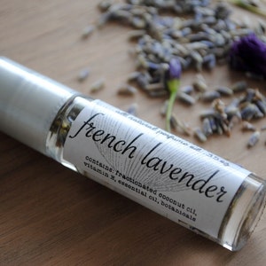 May include: A clear glass roll-on bottle with a silver cap, labelled "french lavender" and containing fractionated coconut oil, vitamin E, essential oil, and botanicals.