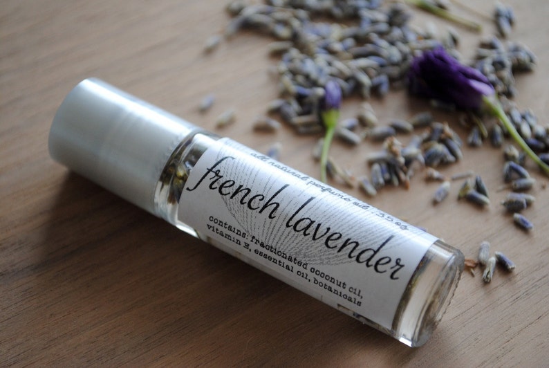 May include: A clear glass roll-on bottle with a silver cap, labelled "french lavender" and containing fractionated coconut oil, vitamin E, essential oil, and botanicals.