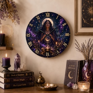May include: A round wall clock featuring a celestial illustration of a person with long dark hair holding a glowing orb. The clock face displays gold Roman numerals against a deep purple and blue cosmic background with stars and a full moon.