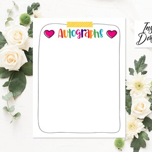 May include: A printable page with a black border and the word "Autographs" in rainbow letters with hearts on either side. The page is surrounded by white flowers and green leaves.