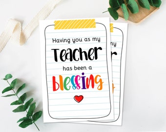 May include: Two printable cards with a lined background and a yellow stripe at the top. The text on the card reads "Having you as my Teacher has been a blessing" with the word "blessing" in rainbow colors and a red heart.