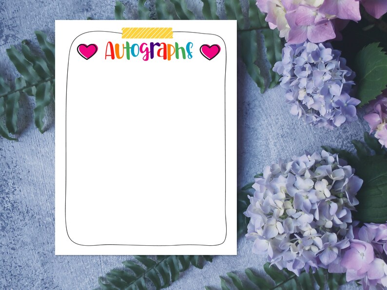 May include: A white printable sheet with a black border and the text "Autographs" in rainbow colors. Two pink hearts are on either side of the text. The sheet is on a blue and gray textured background with pink and purple flowers.