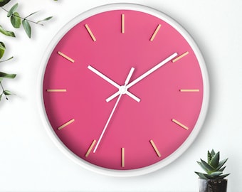 Reloj de pared rosa, silencioso, moderno, de 25 cm (10 pulgadas), con marco blanco o de madera y marcadores dorados.