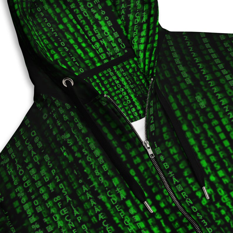 May include: Black zip-up hoodie with a green digital rain pattern. The hoodie features a black hood with drawstrings and a silver zipper. The design is reminiscent of computer code, with green characters on a black background.