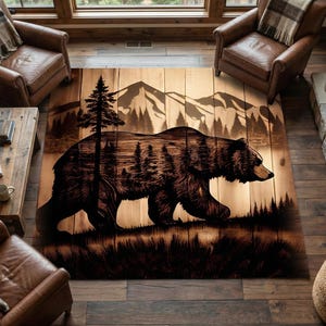 May include: A rectangular wooden rug featuring a detailed silhouette of a bear walking across a forest landscape. The design includes trees, mountains, and a grassy foreground, all in shades of brown.