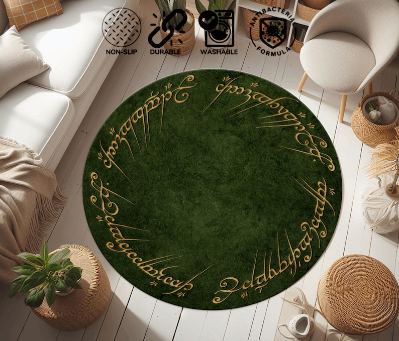 May include: A round green rug with gold lettering around the edge. The rug is on a light wood floor. The rug has a non-slip backing and is washable. The rug is durable and has an antibacterial formula.