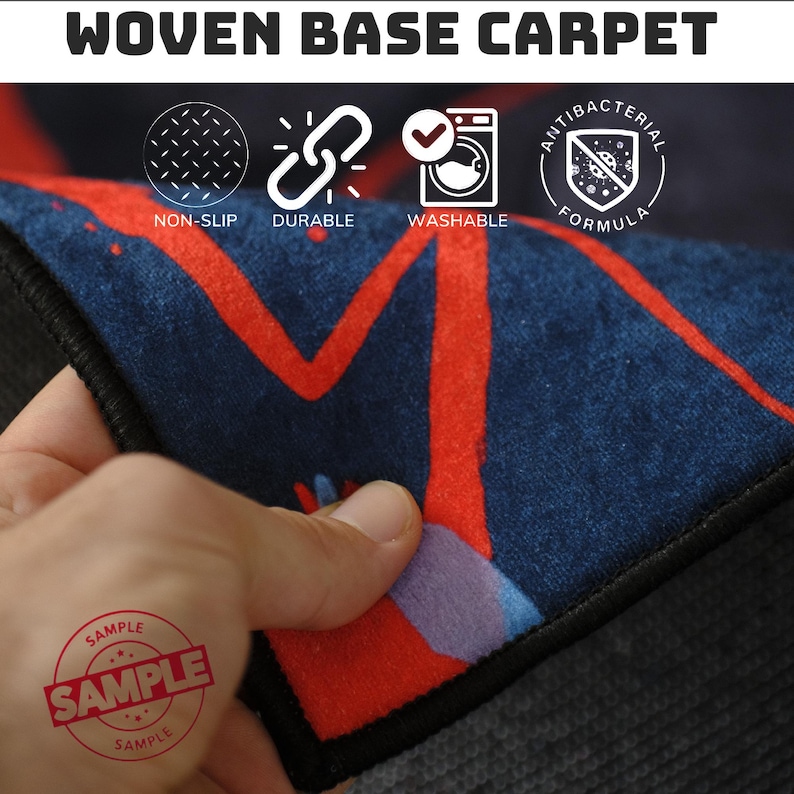 May include: Close-up of a woven base carpet with a navy blue background and red abstract design. The carpet is labeled as non-slip, durable, washable, and antibacterial. The word "SAMPLE" is stamped on the carpet.