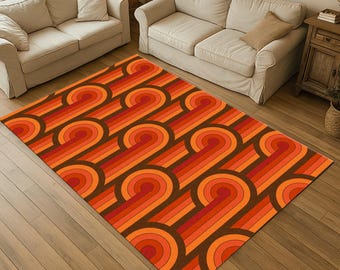 May include: A rectangular rug with a retro design. The rug features a repeating pattern of curved lines in shades of orange, red, and brown. The rug is placed on a wooden floor, and the design is reminiscent of the 1970s.