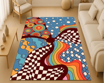May include: A patterned area rug with a psychedelic design. The rug has a blue base with a mix of patterns, including circles, a checkerboard, and rainbow stripes. The rug is a vibrant addition to any room, measuring approximately 200cm x 150cm.