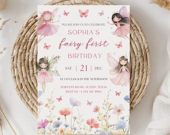 May include: A whimsical invitation for Sophia's first birthday, featuring fairy illustrations in pink dresses and butterfly accents. The invitation includes the text "fairy first birthday" and event details. The invitation is set on a woven placemat.