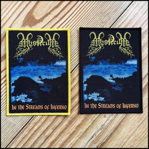May include: Two rectangular patches with a dark landscape design. One patch has a yellow border, the other a black border. Both feature the band name "Mysticuffe" in yellow and the text "In the Streams of Inferno" in yellow.