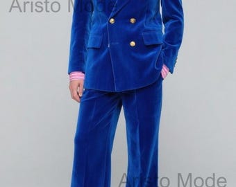 May include: A vibrant blue velvet suit with a double-breasted jacket and matching wide-leg trousers. The jacket features gold buttons and a pink striped shirt underneath. The image includes the text "Aristo Mode".