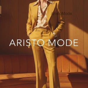 May include: Mustard yellow suit with a patterned shirt. The suit includes a blazer and flared pants. The shirt has a cream background with a brown pattern. The text "ARISTO MODE" is displayed in white.