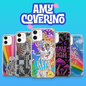 May include: A collection of phone cases with unique designs. The cases feature colorful illustrations including skeletons, rainbows, mushrooms, and the text "Stay High". The brand name "Amy Coverino" is displayed at the top in a stylized font.