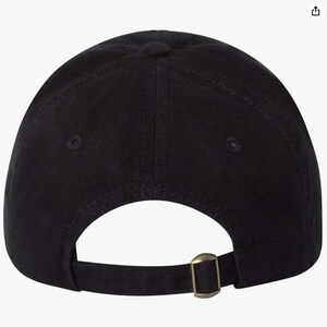 May include: Black baseball cap with a curved brim and adjustable strap. The cap features a metal buckle closure on the back for a secure fit. The hat is made of a solid black fabric.