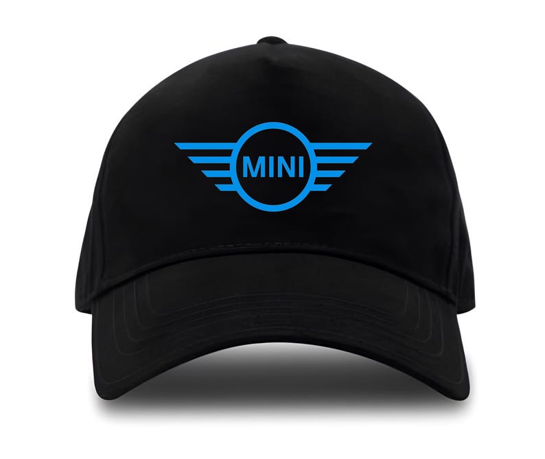 May include: Black baseball cap with a curved brim. The cap features a blue logo with the word "MINI" inside a circle, flanked by stylized wings. The hat is made of a durable fabric and is suitable for outdoor wear.