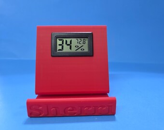 Phone Stand with a Temperature and Humidity Meter