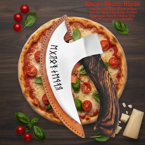 May include: A stainless steel pizza axe with a wooden handle and a leather sheath, on a pizza. The axe has a curved blade and text in a foreign language. The pizza is topped with tomatoes and basil.
